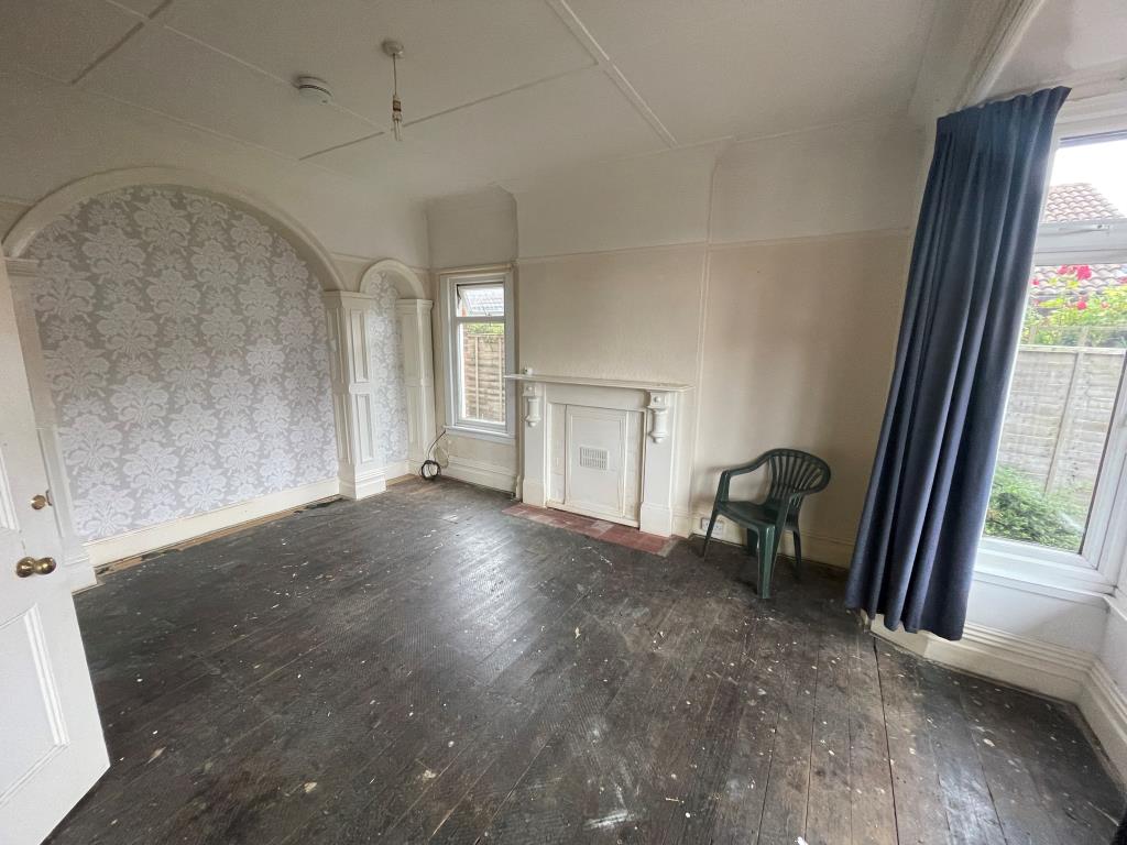 Lot: 129 - DETACHED BLOCK OF FOUR SELF-CONTAINED FLATS - Living room with bay window and wooden floor